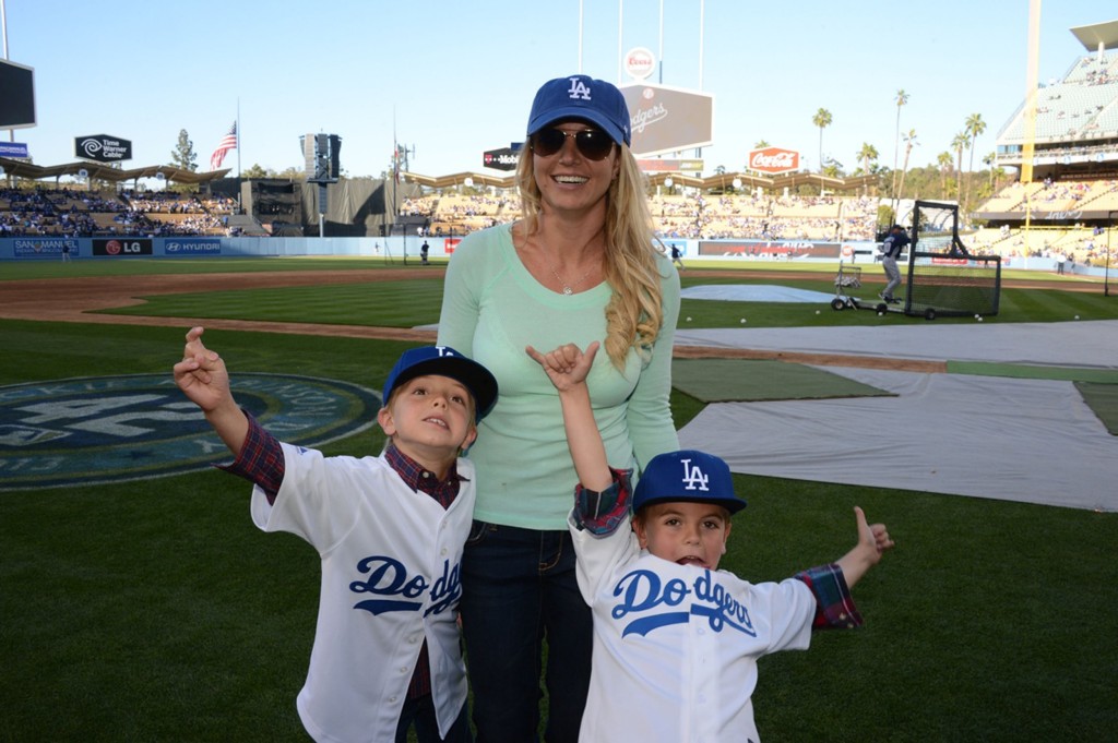 In happier times: Britney with her boys at a baseball game in 2013 (Picture: Getty) 