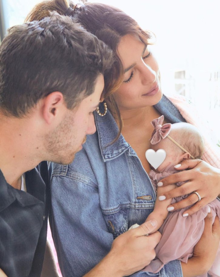 Nick Jonas and wife Priyanka Chopra with new daughter Malti Marie.