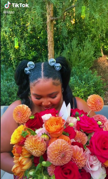 lizzo with flowers
