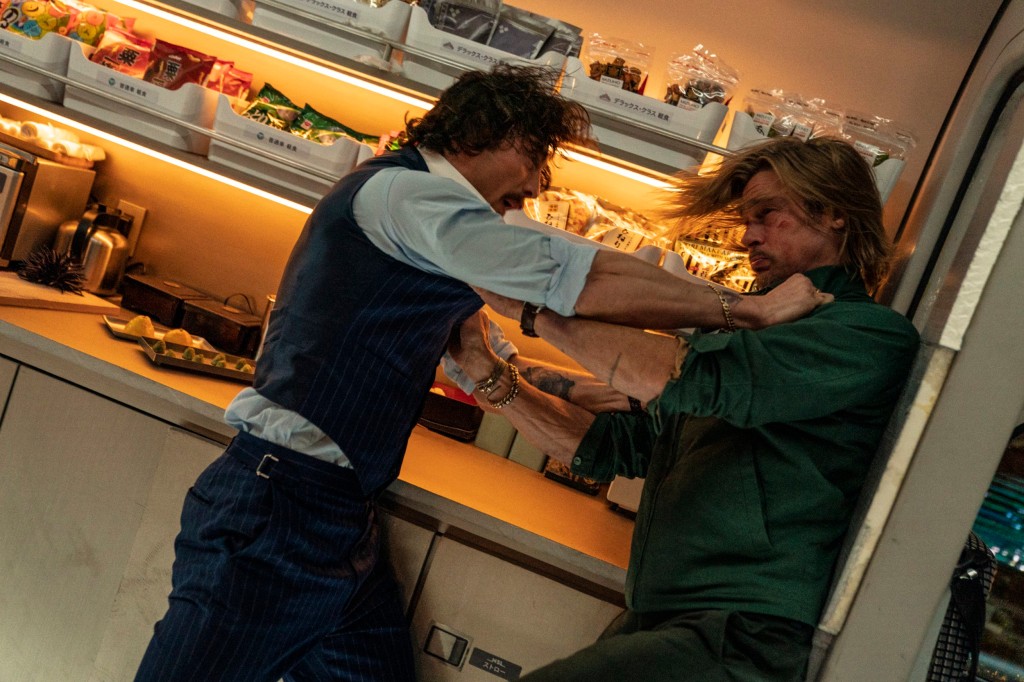 This image released by Sony Pictures shows Aaron Taylor-Johnson, left, and Brad Pitt in a scene from 