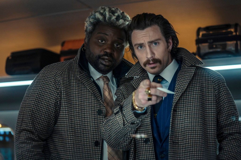 This image released by Sony Pictures shows Bryan Tyree Henry, left, and Aaron Taylor-Johnson in a scene from 
