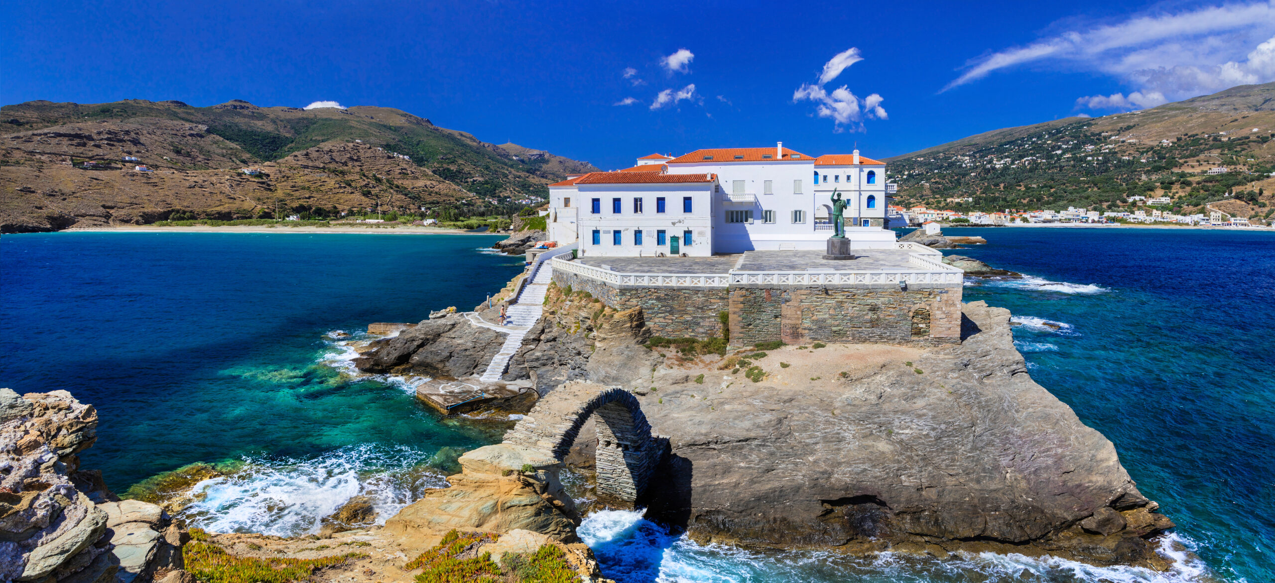 A white building on a small Greek island
