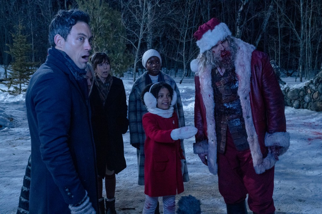 (from left) Jason (Alex Hassell), Gertrude (Beverly Dâ€™Angelo), Alva (Edi Patterson), Linda (Alexis Louder), Trudy (Leah Brady) and Santa (David Harbour) in Violent Night, directed by Tommy Wirkola.
