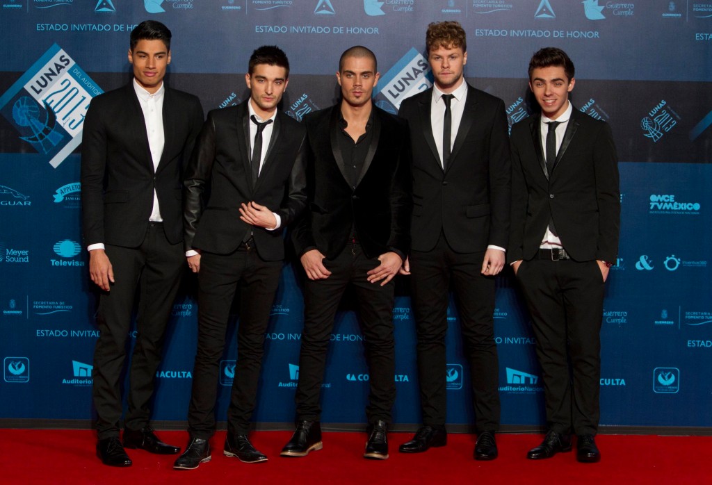 FILE - Pop band The Wanted pose on the red carpet before the Lunas del Auditorio award ceremony in Mexico City, Oct. 30, 2013. From right: Nathan Sykes, Jay McGuiness, Max George, Tom Parker and Siva Kaneswaran. Tom Parker, a member of British-Irish boy band The Wanted, has died after being diagnosed with an inoperable brain tumor. He was 33. The band announced that Parker died Wednesday, March 30, 2022, ???surrounded by his family and his band mates.??? (AP Photo/Christian Palma, file)