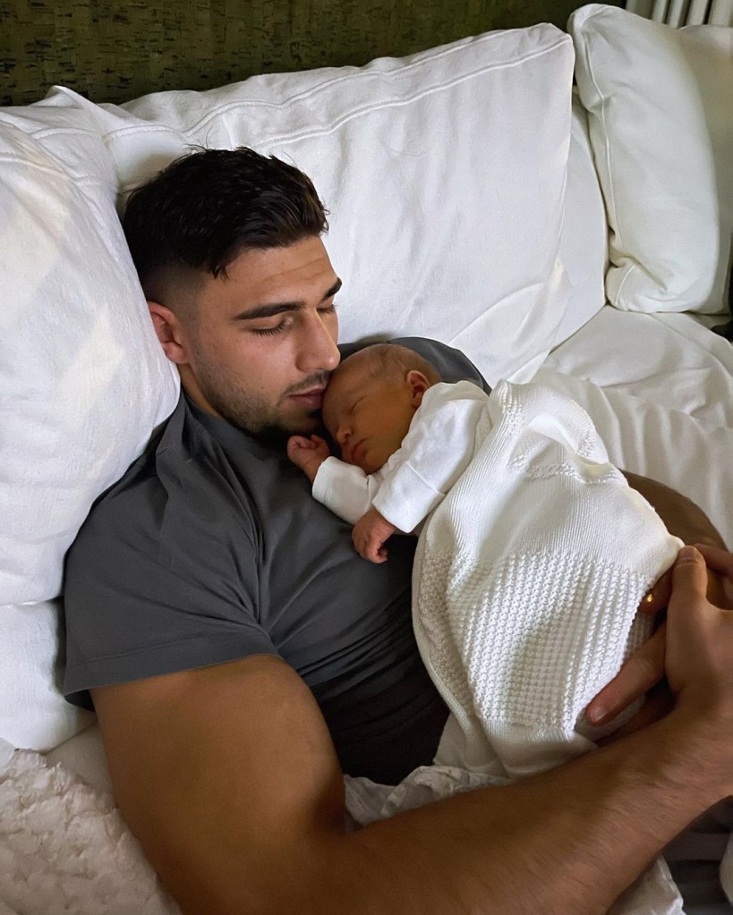 Tommy Fury holding daughter Bambi