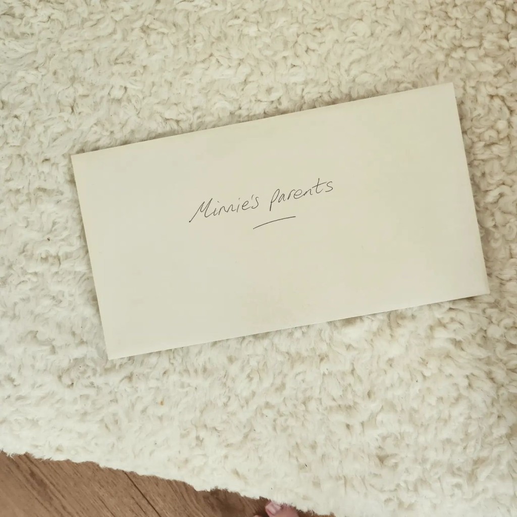 envelope with 'minnie's parents' written on