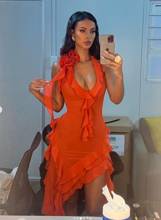 Maya Jama in orange dress on love island