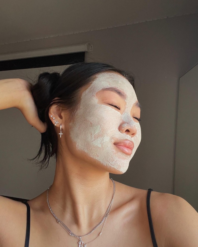A woman with skincare on her face.