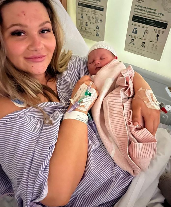 Shaughna Phillips cradling baby daughter Lucia