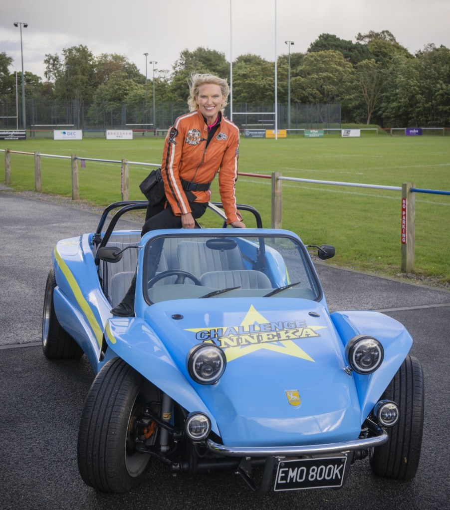 Anneka Rice on Challenge Anneka in a little blue car.