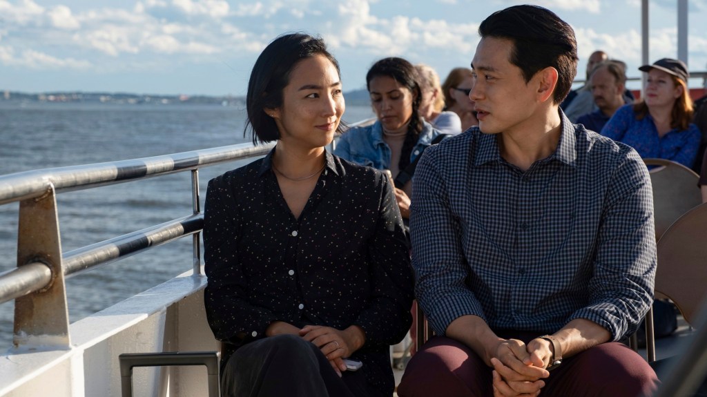 This image released by A24 shows Greta Lee, left, and Teo Yoo in a scene from 