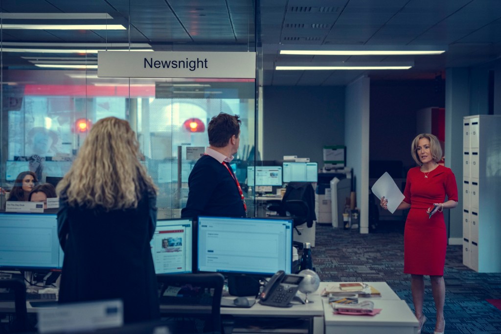 Gillian Anderson as Emily Maitlis in the Newsnight office at BBC headquarters in Scoop, with Billie Piper as Sam McAlister with back to camera
