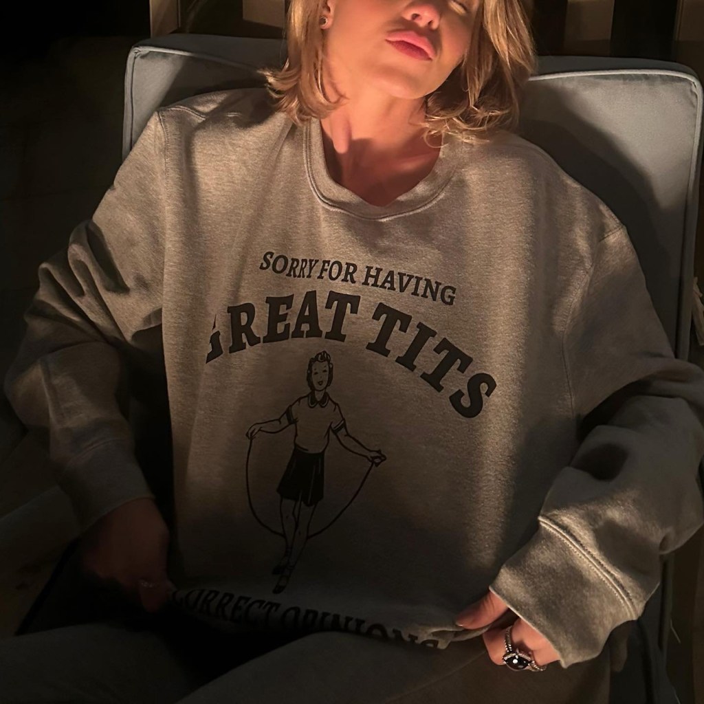 Sydney Sweeney wearing a shirt that says 'sorry for having great tits and correct opinions'
