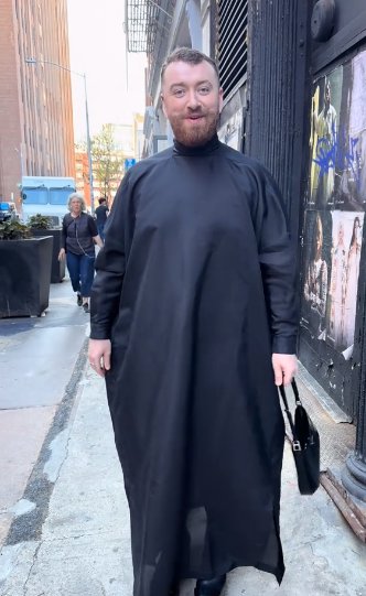 Sam Smith in a black robe